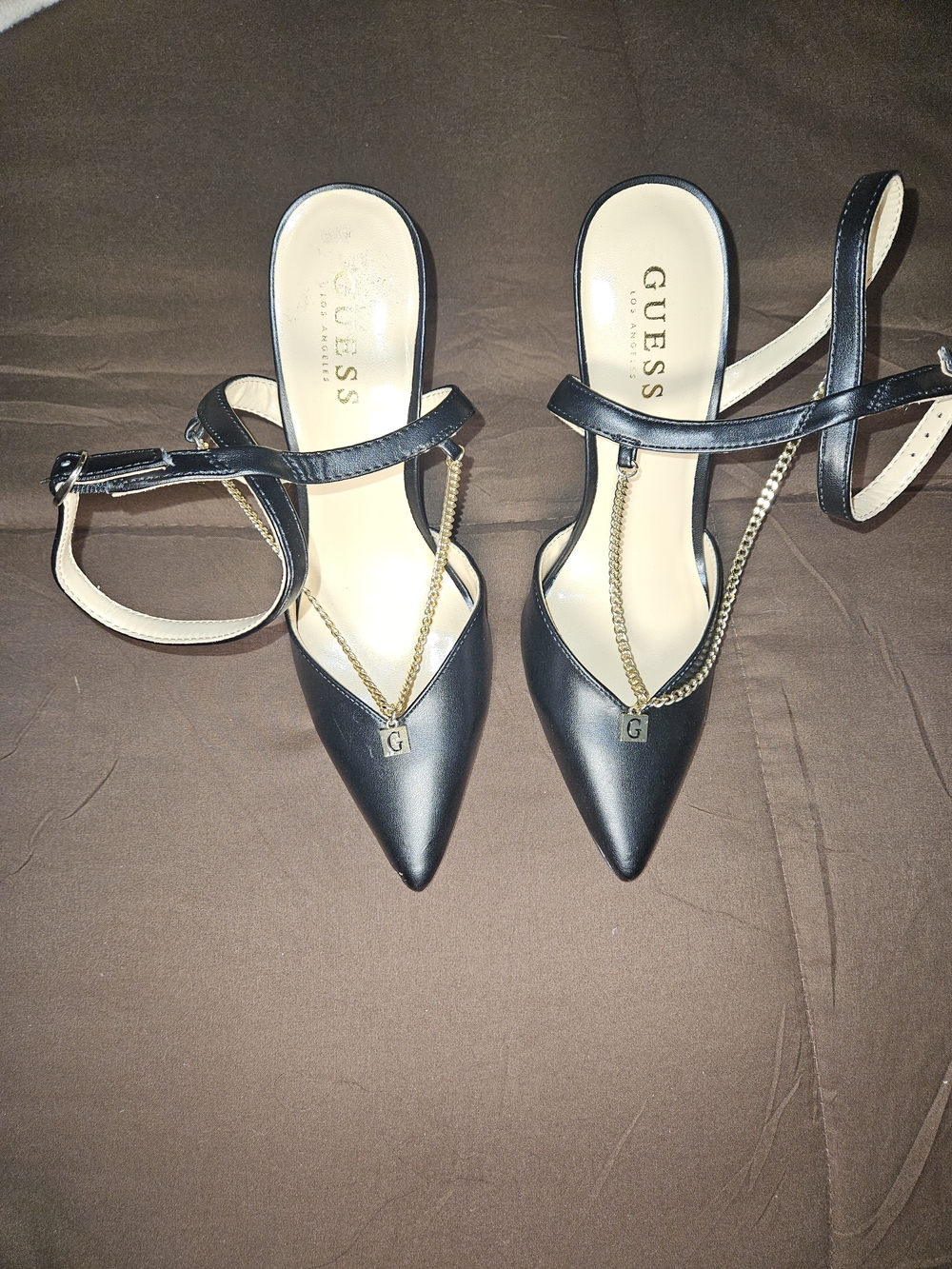 GUESS Black Pointed Toe Ankle Strap Heels with Gold Chain Accent